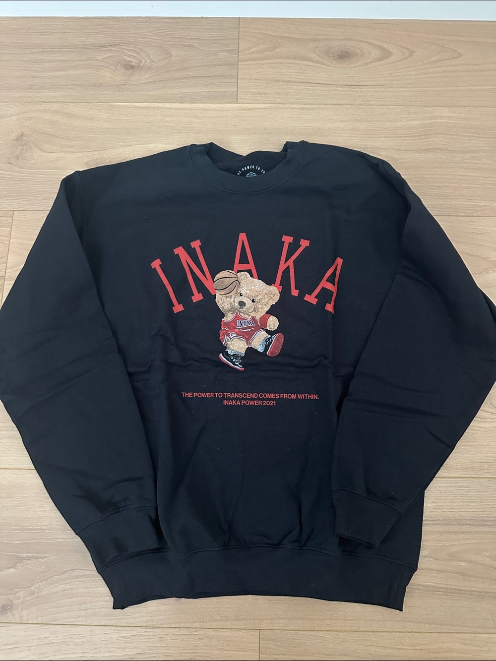 Inaka Power Black Crewneck Sweater with Red Logo and Teddy Bear